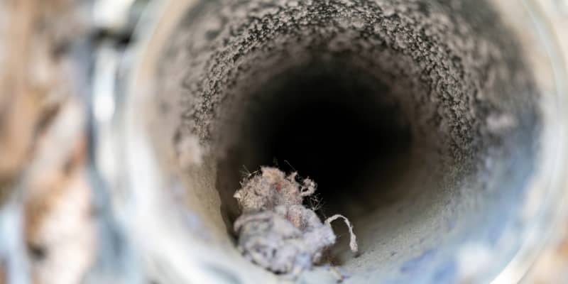An inside look at a dirty air duct.